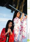 two-girls-sword-hands-14229342.jpg