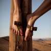 01622-3565514523-2 feet nailed to a wood post,hd,highly detailed,realistic,canon 5d.jpg