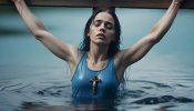 a-crucified-woman-in-blue-tanktop-in-the-water-nailed-to-a-cross edited.jpg