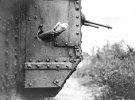 0-A message-carrying pigeon being released from a port-hole in the side of a British Mark V ta...jpg