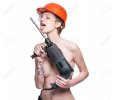 0-73612264-young-woman-holding-a-construction-drill-seductive-female-builder-worker-in-hard-ha...jpg