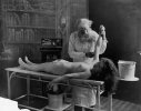 Nude girl on table being autopsied by doctor.jpg