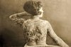 portrait-of-a-tattooed-woman-c-1895_a-l-12047711-4990831.jpg