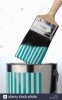 tin-of-striped-paint-with-paint-brush-A678XG.jpg