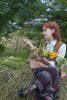 480px-Ieva_creating_a_crown_from_flowers,_Midsummer_festival,_Latvia.jpg