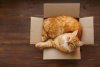 Orange-cat-looking-up-in-a-box.jpg