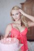 sexy-blonde-woman-holding-birthday-cake-pink-lingerie-54379896.jpg